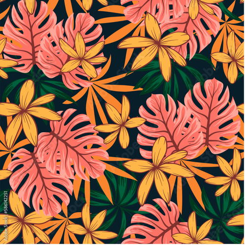 Trendy seamless tropical pattern with bright plants and flowers on a dark background. Seamless exotic pattern with tropical plants. Exotic wallpaper.