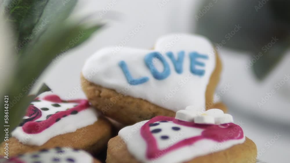Heart shaped sugar cookies decorated with royal icing in gift box. Valentine's day romantic gift Heart shaped sugar cookies decorated with royal icing in gift box. Valentine's day romantic gift