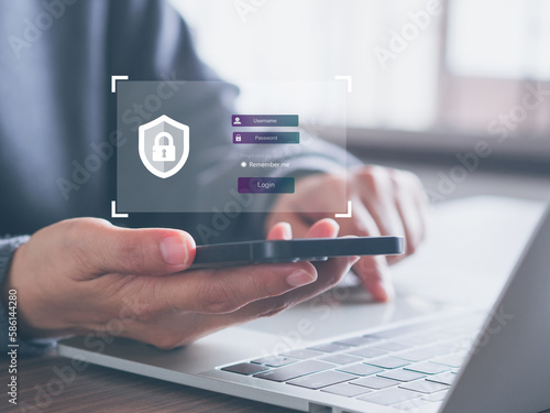 Hand-holding smartphone showing padlock icon and login with password. Security of personal information. Cyber security, data protection concept. . © Ben_24