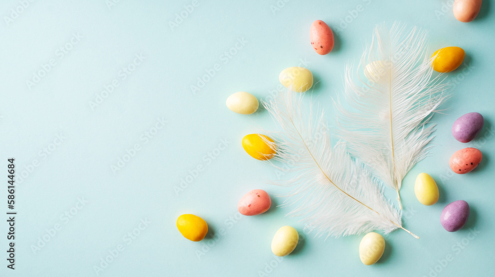 Color sweet candy and feather on blue background Color sweet candy and feather on blue background