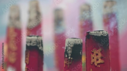 Smoking incense sticks burn to worship the Taoist Gods at a temple during Chinese Lunar New Year (CNY) festivities and celebrations in Hong Kong.