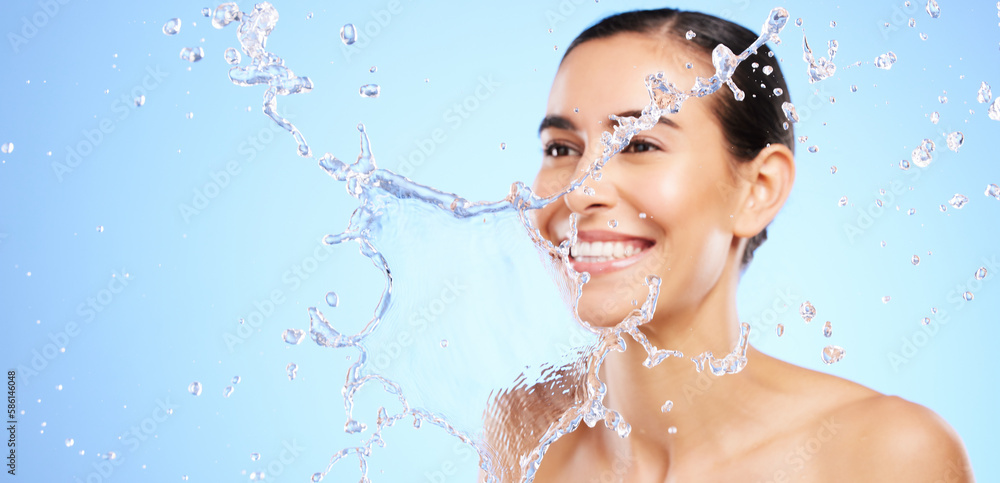 Water splash, smile or happy girl with face wash for skincare or hygiene on blue background in studio. Banner, mockup or woman with wellness cleaning or washing in beauty grooming or facial treatment Water splash, smile or happy girl with face wash for skincare or hygiene on blue background in studio. Banner, mockup or woman with wellness cleaning or washing in beauty grooming or facial treatment