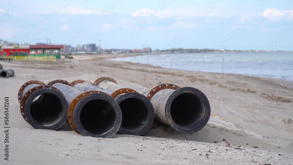 Four tubes resting on the sand of the beach Four tubes resting on the sand of the beach