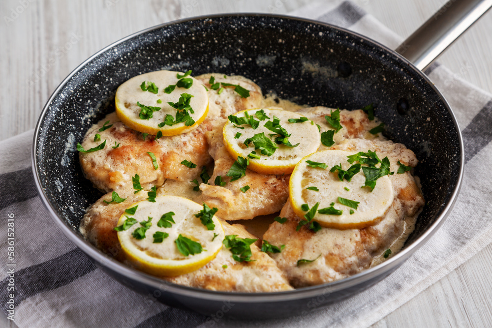 Homemade Creamy Lemon Chicken in a Pan, side view.