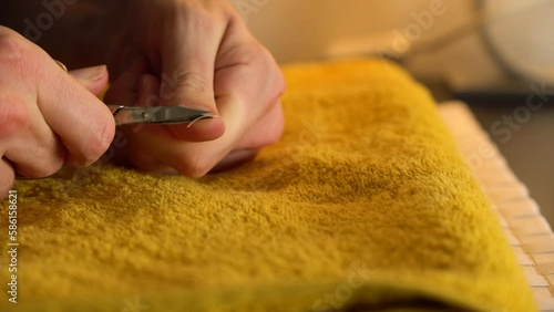 A man cuts his nails - closeup photo