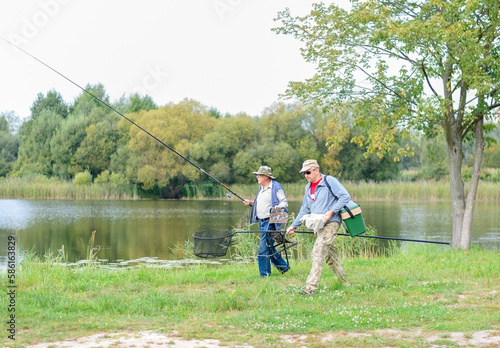 Anglers go fishing with beautiful view of lake. lifestyle