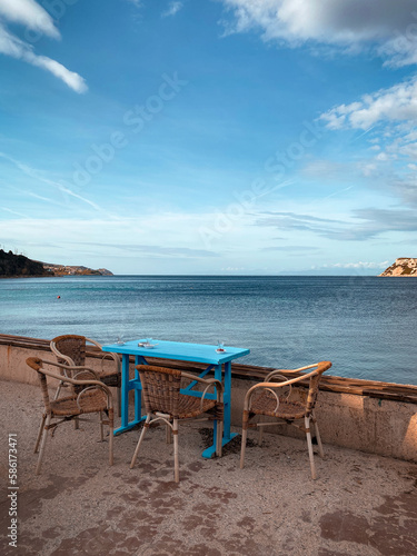 coffee table with mesmerizing view seaside © Firdevs