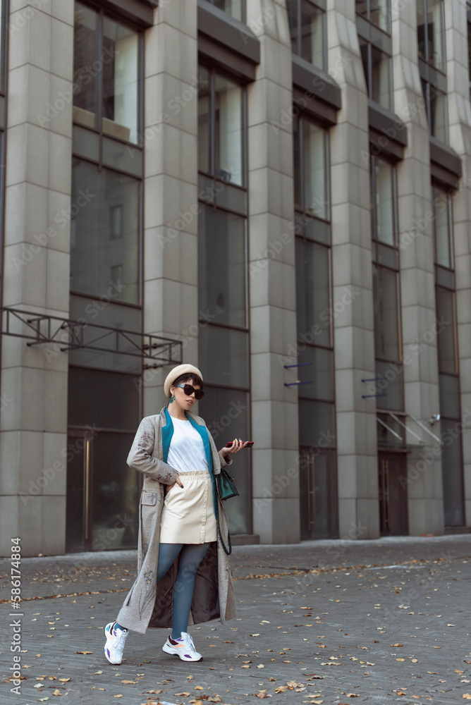 Brunette in a beret in the autumn city Brunette in a beret in the autumn city