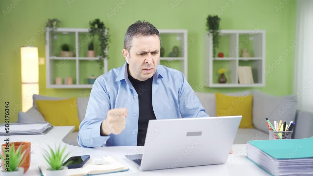 Home office worker angry at what he sees on laptop.
The businessman working at home gets angry with what he sees on the laptop and quits the job.
Home office worker angry at what he sees on laptop.
The businessman working at home gets angry with what he sees on the laptop and quits the job.