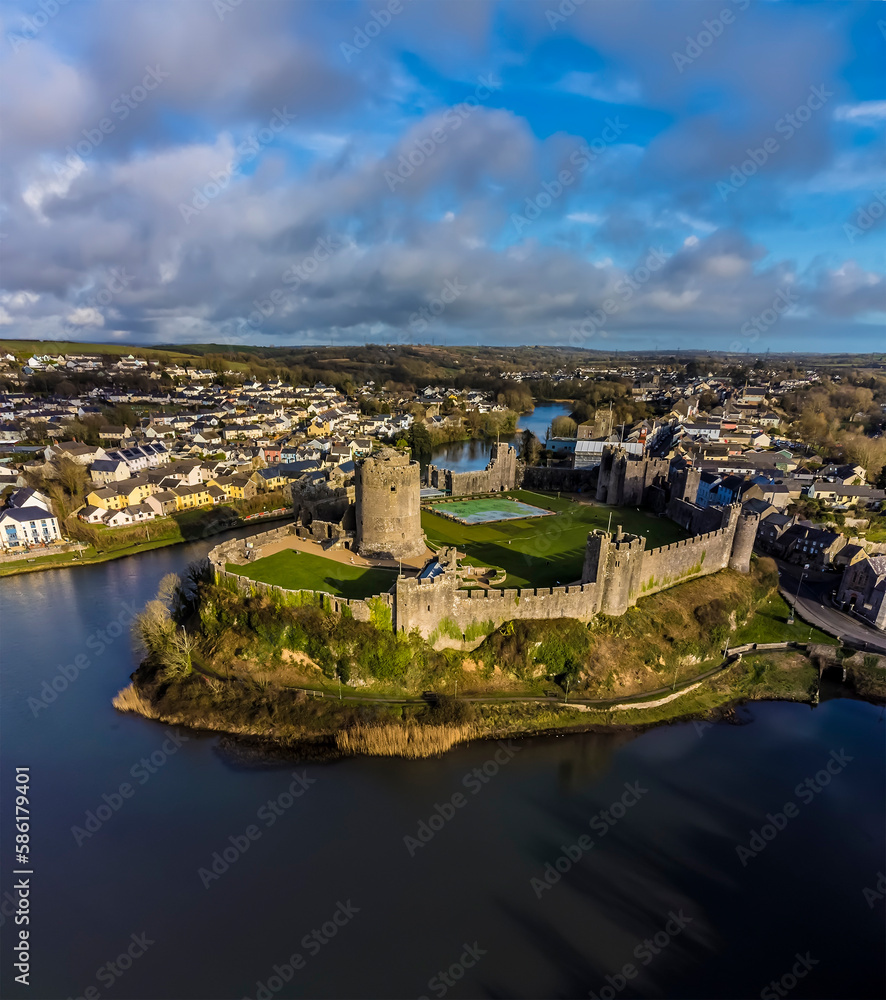 An aerial view above the castle and the River Cleddau at Pembroke, Wales just before sunset