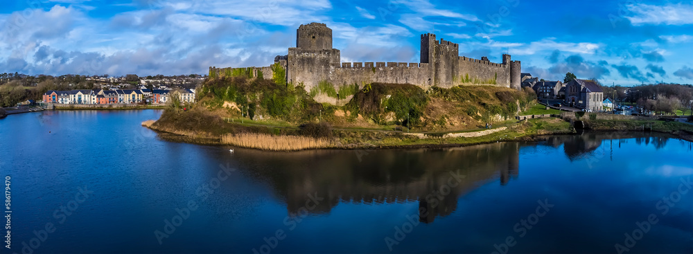 An aerial view of the west side of the castle at  Pembroke, Wales just before sunset