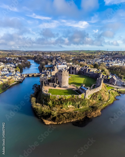 An aerial view down the River Cleddau beside the castle at Pembroke, Wales just before sunset