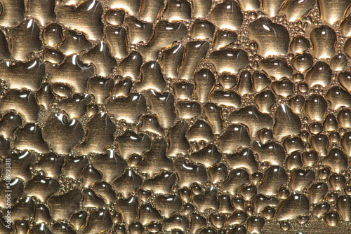 macro photo of water drops on metal