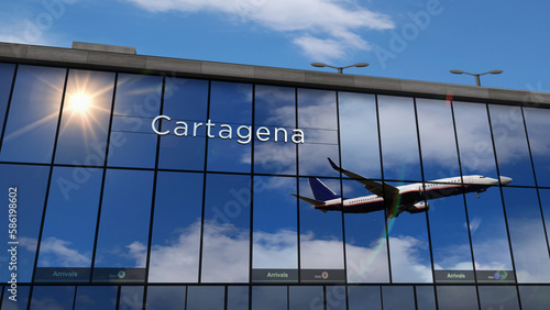 Airplane landing at Cartagena airport mirrored in terminal