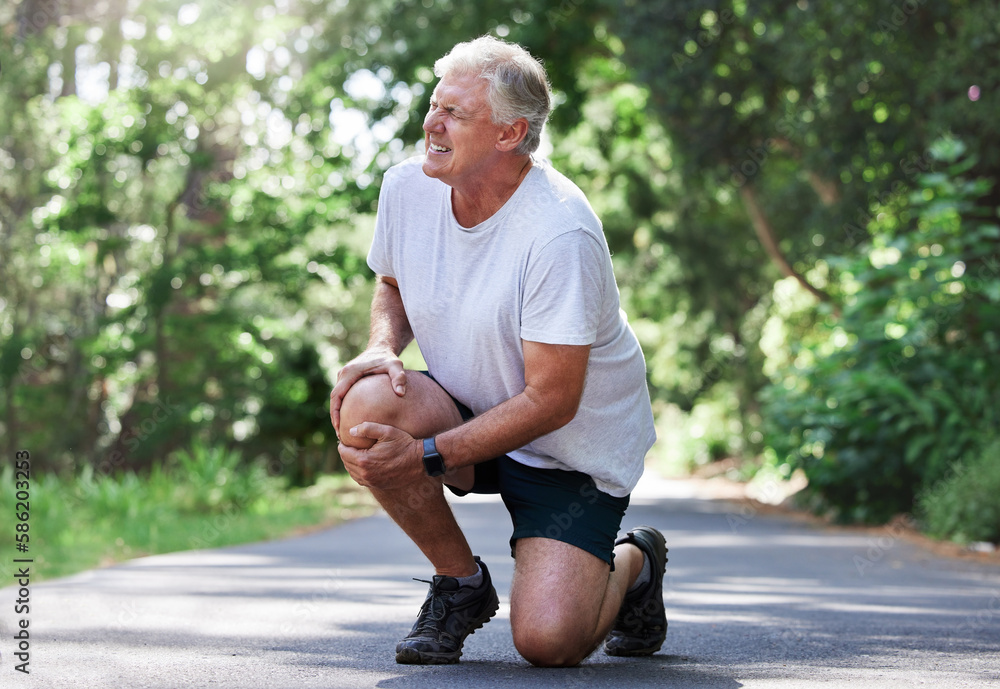 Running, injury and old man with knee pain on path in nature for