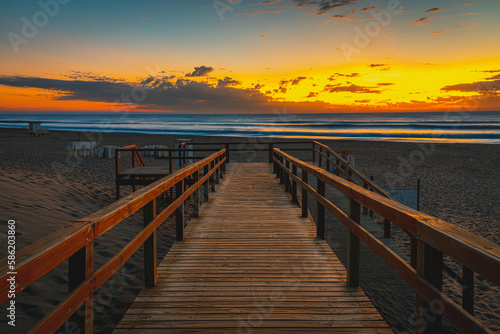 wooden bridge at sunset © Guillermo