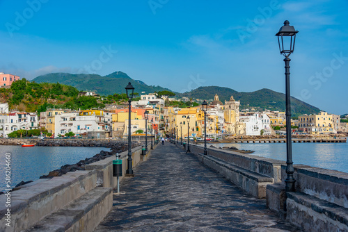 Seaside view of Porto d'Ischia town viewed from a bridge to the Aragonese castle at Ischia island, Italy