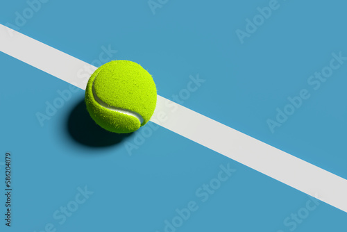 Tennis ball on the court line with blue background. Abstract 3D rendering. © Cagkan