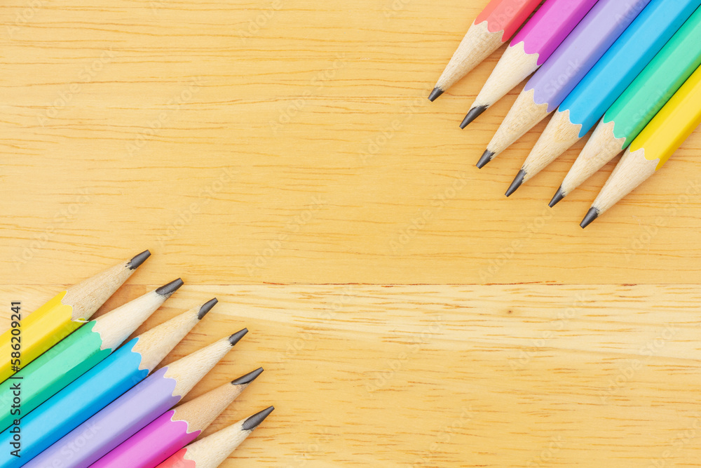 Pastel color pencils background on wood desk Pastel color pencils background on wood desk