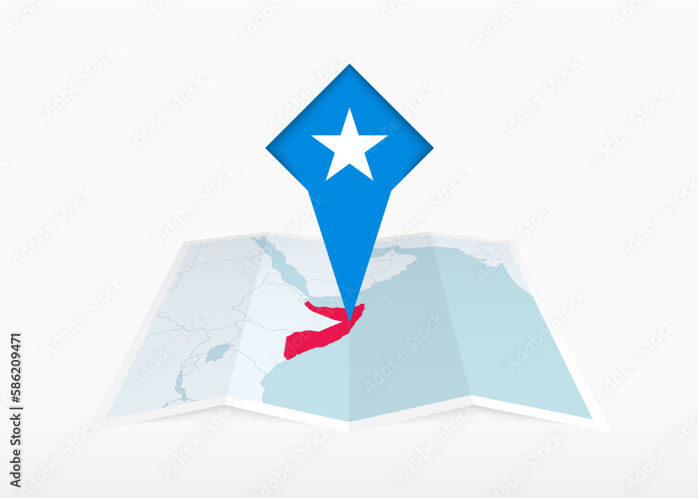 Somalia is depicted on a folded paper map and pinned location marker with flag of Somalia. Somalia is depicted on a folded paper map and pinned location marker with flag of Somalia.