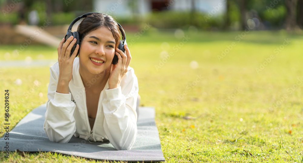 Portrait of smiling beauty asian woman happy and relax listening to music with headphones and singing, happy calm, resting ,good healthy, podcast, sound audio, listen online song at green park Portrait of smiling beauty asian woman happy and relax listening to music with headphones and singing, happy calm, resting ,good healthy, podcast, sound audio, listen online song at green park