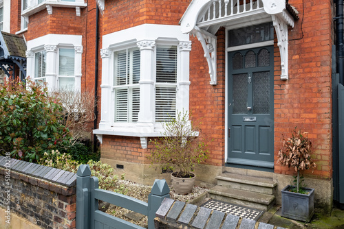 UK- A typical red brick suburban house front door and bay window in South London photo