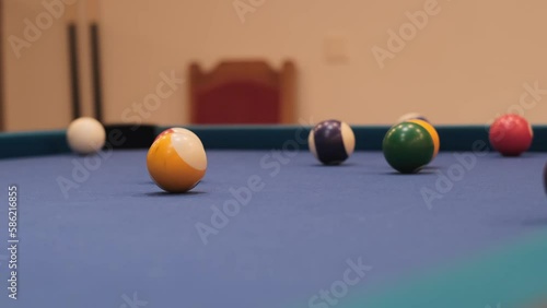 American Pool, the shot eight ball going in billiard pocket photo