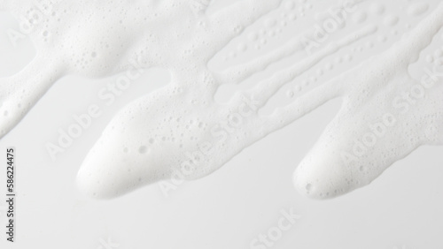 Abstract background white soapy foam texture. Shampoo foam with bubbles