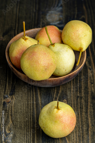 harvested sweet ripe pear in drops of water photo