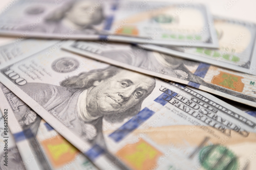 A close-up of a hundred dollar bill featuring Benjamin Franklin, the iconic symbol of American finance and success. The perfect representation of wealth, prosperity and credit exchange. A close-up of a hundred dollar bill featuring Benjamin Franklin, the iconic symbol of American finance and success. The perfect representation of wealth, prosperity and credit exchange.