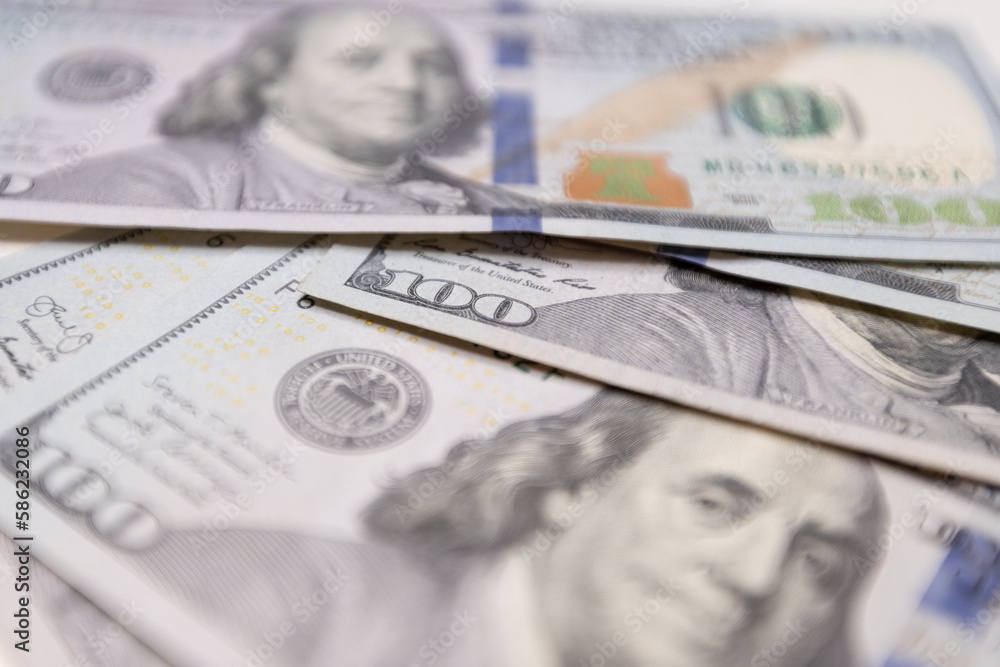 A close-up of a hundred dollar bill featuring Benjamin Franklin, the iconic symbol of American finance and success. The perfect representation of wealth, prosperity and credit exchange. A close-up of a hundred dollar bill featuring Benjamin Franklin, the iconic symbol of American finance and success. The perfect representation of wealth, prosperity and credit exchange.