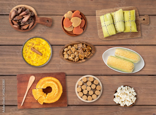 Typical brazilian june festival food over wooden table. Festa junina