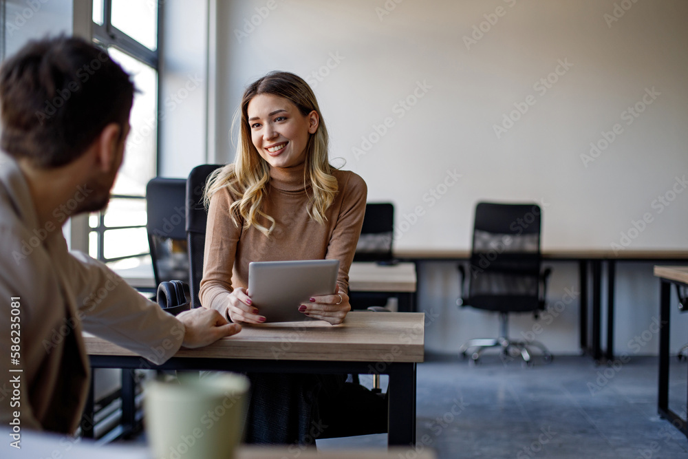 Business colleagues having a conversation Business colleagues having a conversation