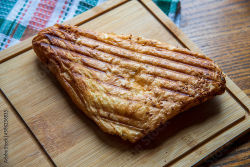 Freshh croissant on a wooden board...  photo