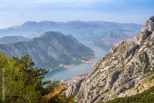 Aerial view of famous Kotor bay with picturesque rocks  old town and cruise ship at the port.