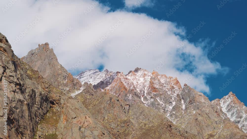 4K shot of clouds above the snow covered Himalayan mountains as seen on the way to Rohtang Pass near Manali in Himachal Pradesh, India. 4K shot of clouds above the snow covered Himalayan mountains as seen on the way to Rohtang Pass near Manali in Himachal Pradesh, India.