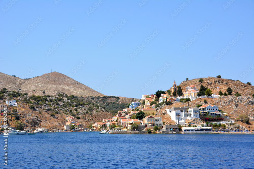 A view of the town Symi on greek island from the water, copy space
