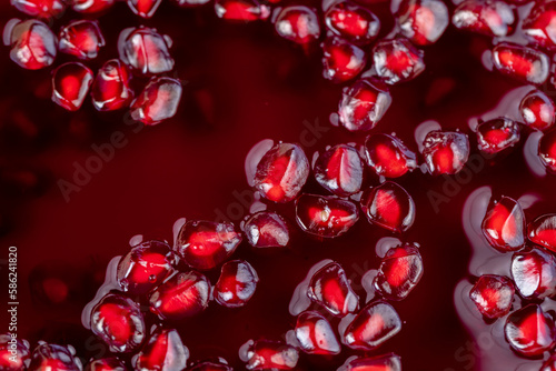 peeled red ripe pomegranate with red sweet grains