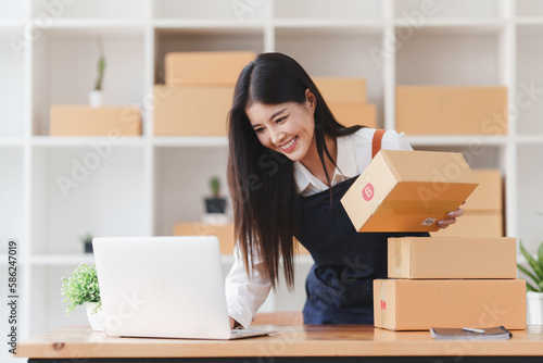 Small businesses SME owners female entrepreneurs check online orders to prepare to pack the boxes, sell to customers, sme business ideas online