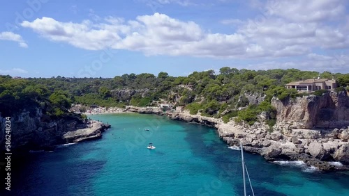 Cinematic Drone Shot passing Yachts in a beautiful Bay in Mallorca