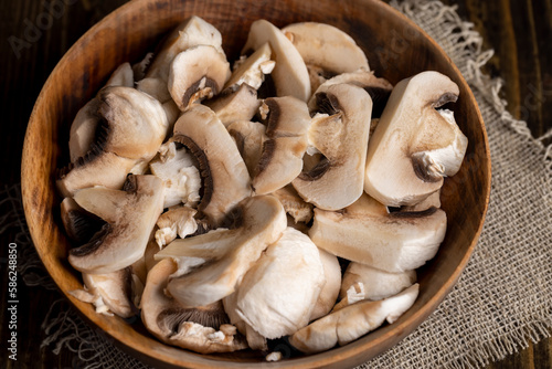 Peeled, washed and cut mushrooms champignons during cooking