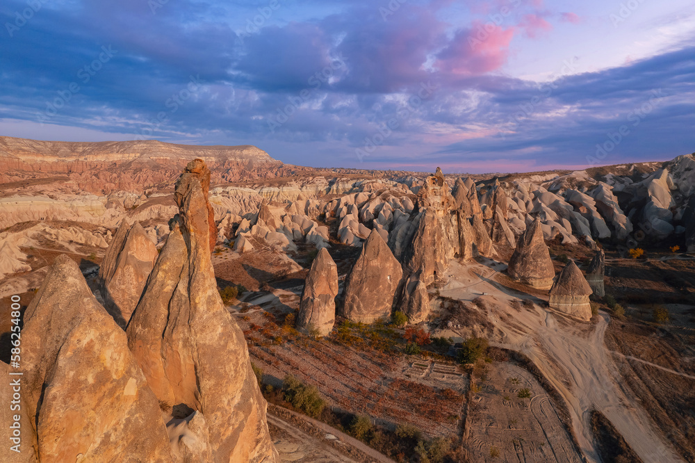 Sunset landscape Cappadocia stone old cave house in Goreme national park Turkey, Aerial top view travel