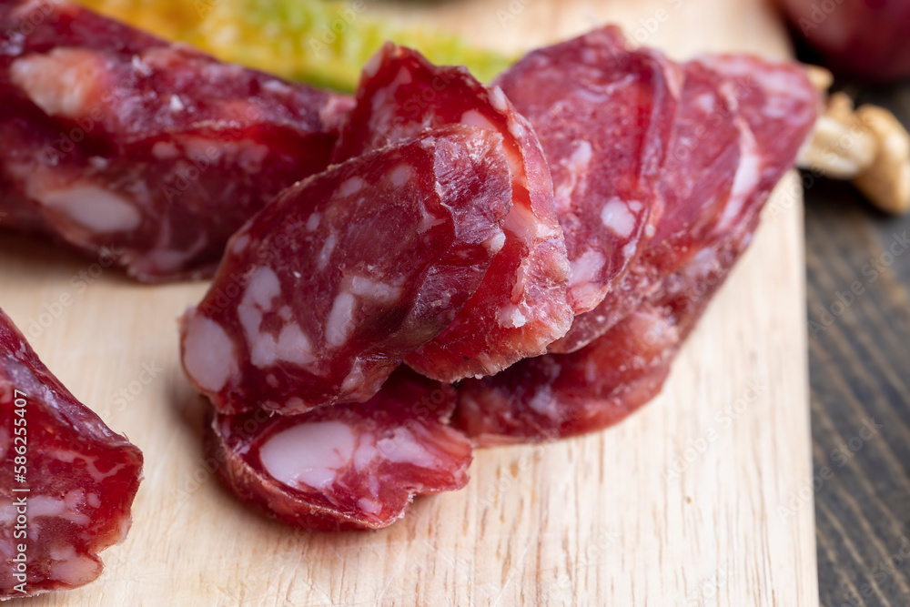 sliced sausage from pieces of meat with bacon sliced sausage from pieces of meat with bacon