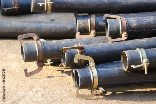 Group of HDPE pipe with metal clamps used in water supply