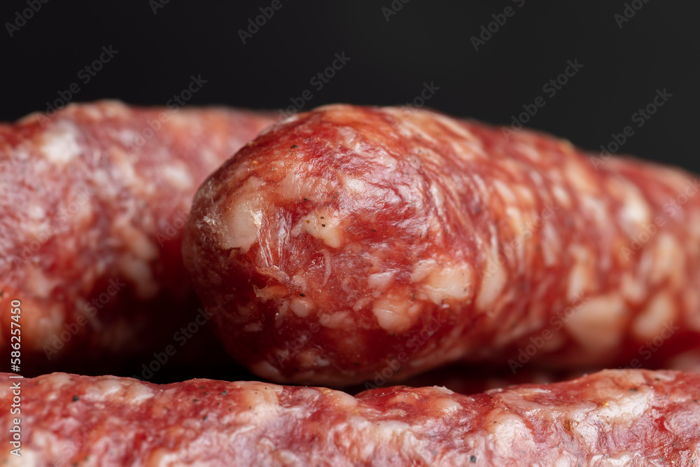 Dried pork sausage during slicing Dried pork sausage during slicing