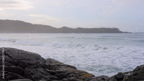 Wallpaper Mural Establishing shot of ocean beach with waves and rocks in slow motion at summer day in Vancouver, Canada, North America. Day time on February 2023. Still camera. ProRes 422 HQ. Torontodigital.ca