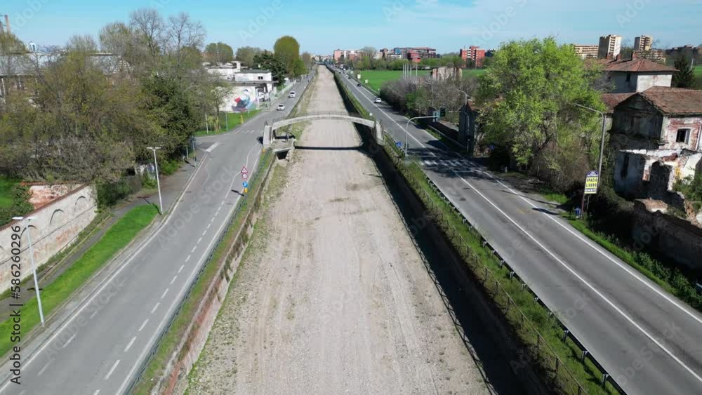 Italy , Milan - Drone aerial view of drought and aridity in Navigli canal river no water - water emergency and reduction of water consumption - Climate change global warming Italy , Milan - Drone aerial view of drought and aridity in Navigli canal river no water - water emergency and reduction of water consumption - Climate change global warming