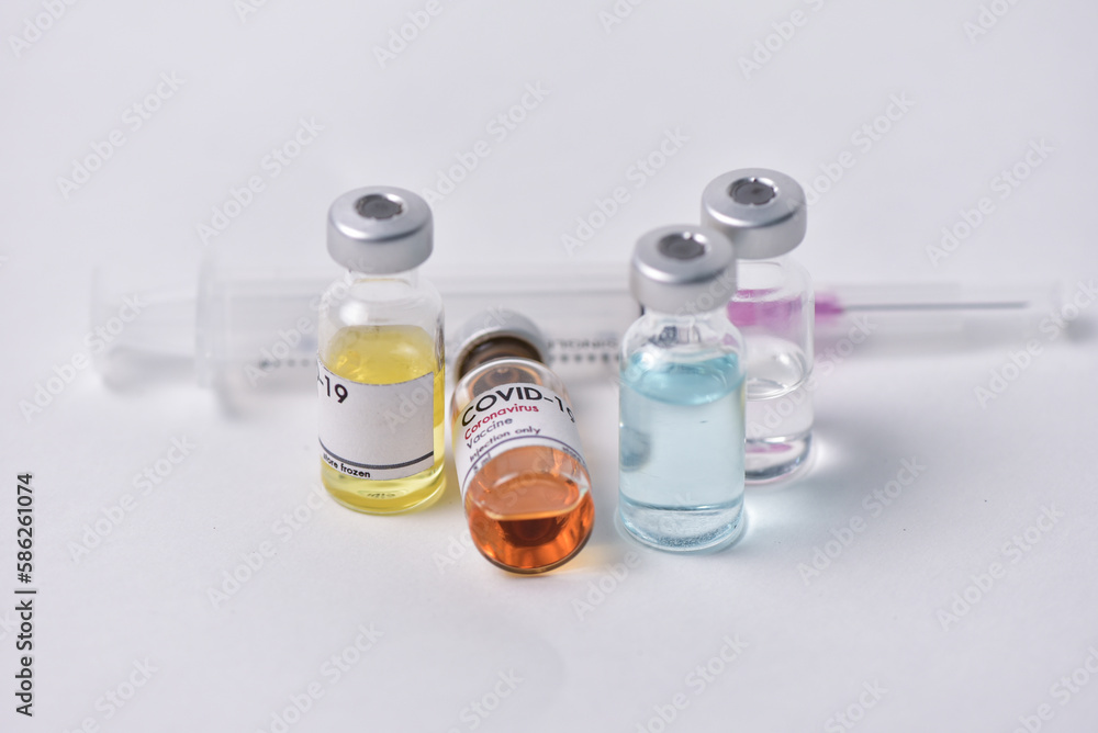 Vaccine bottle. Syringe on white background. Vaccination against quarantine coronavirus or covid-19, virus prevention and infection control. drug therapy concept Vaccine bottle. Syringe on white background. Vaccination against quarantine coronavirus or covid-19, virus prevention and infection control. drug therapy concept