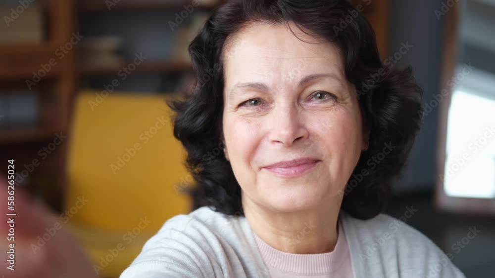 Portrait of confident stylish european middle aged senior woman. Older mature 60s lady smiling at home. Happy attractive senior female looking camera close up face headshot portrait. Happy people Portrait of confident stylish european middle aged senior woman. Older mature 60s lady smiling at home. Happy attractive senior female looking camera close up face headshot portrait. Happy people