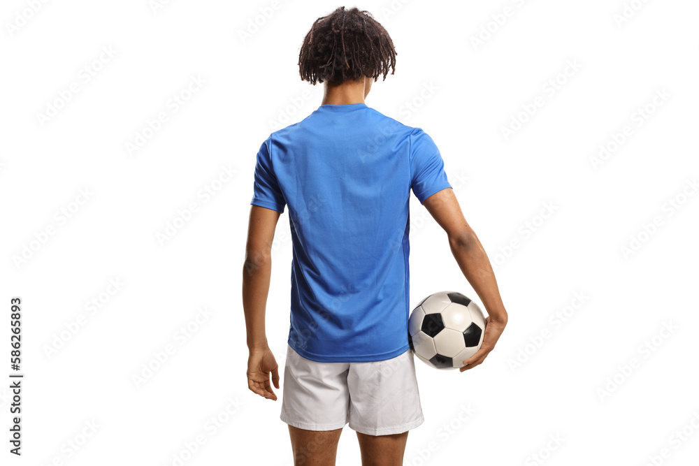 Rear view shot of an african american football player holding a ball Rear view shot of an african american football player holding a ball